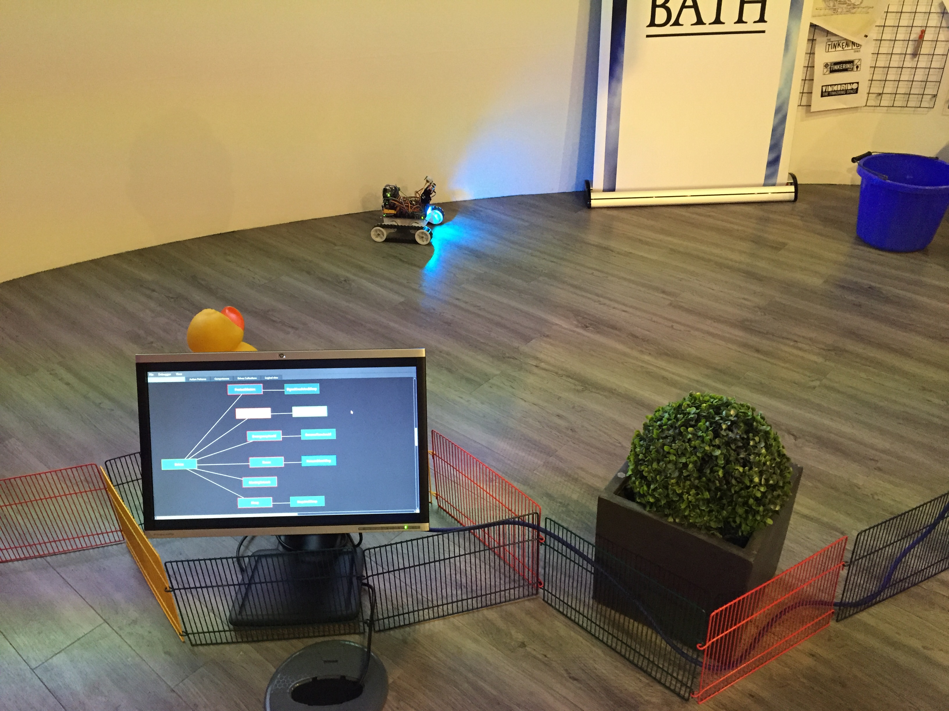Scene with R5 robot in an enclosure with other objects